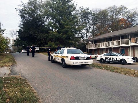 Clarksville Police work the scene on Beech Street where a Dead Woman was found Thursday.