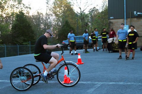 A Soldier from 101st Special Troops Battalion, 101st Airborne Division (Air Assault) Sustainment Brigade, 101st Abn. Div., maneuvers a bicycle around cones, Nov. 3, 2016, next to the brigade’s resiliency center building while wearing goggles that simulate a high alcohol consumption level. Fort Campbell’s Army Substance Abuse Program ran the event as part of the brigade’s “Not in My Squad” Week. (Sgt. Neysa Canfield/101st Airborne Division Sustainment Brigade Public Affairs) 