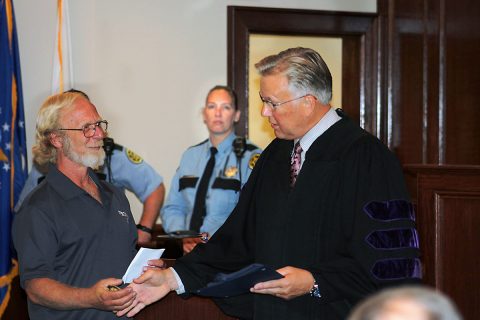 Montgomery County Veterans Treatment Court (VTC) for Life member Dean Viertel accepting his certificate from VTC Judge Kenneth Goble Jr.