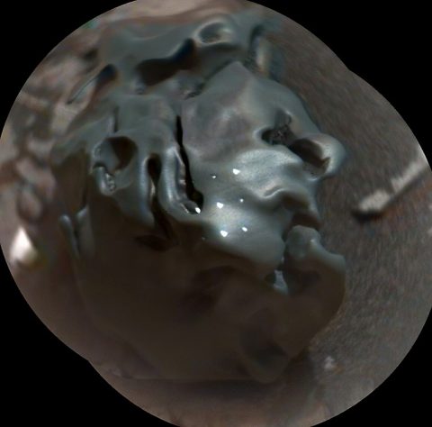 The dark, golf-ball-size object in this composite, colorized view from the ChemCam instrument on NASA's Curiosity Mars rover is a nickel-iron meteorite, as confirmed by analysis using laser pulses from ChemCam on Oct. 30, 2016. The grid of bright spots on the rock resulted from the laser pulses. (NASA/JPL-Caltech/LANL/CNES/IRAP/LPGNantes/CNRS/IAS/MSSS) The dark, golf-ball-size object in this composite, colorized view from the ChemCam instrument on NASA's Curiosity Mars rover is a nickel-iron meteorite, as confirmed by analysis using laser pulses from ChemCam on Oct. 30, 2016. The grid of bright spots on the rock resulted from the laser pulses. (NASA/JPL-Caltech/LANL/CNES/IRAP/LPGNantes/CNRS/IAS/MSSS)
