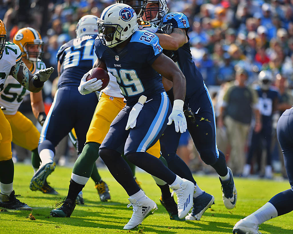 Tennessee Titans running back DeMarco Murray (29) breaks through the line and scores a touchdown during the first half against the Green Bay Packers at Nissan Stadium. (Christopher Hanewinckel-USA TODAY Sports)