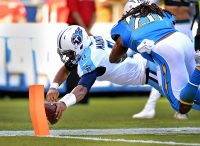 Tennessee Titans quarterback Marcus Mariota (8) dives in for a third quarter touchdown as San Diego Chargers free safety Dwight Lowery (20) defends at Qualcomm Stadium. (Jake Roth-USA TODAY Sports)