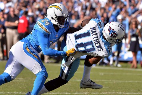 Tennessee Titans wide receiver Rishard Matthews (18) dives in the end zone for a touchdown as he is defended by San Diego Chargers cornerback Brandon Flowers (24) during the second quarter at Qualcomm Stadium. (Orlando Ramirez-USA TODAY Sports)