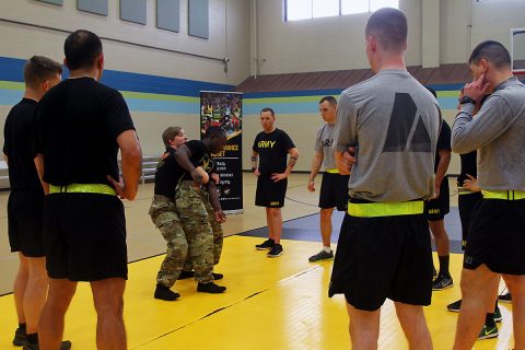 Sgt. Whitney Conder and Sgt. Spenser Mango, both wrestlers with the U.S. Army World Class Athlete Program, demonstrate take down techniques to Soldiers of 101st Airborne Division (Air Assault) Sustainment Brigade, 101st Abn. Div., Nov. 15, 2016 at Shaw Physical Fitness Center on Fort Campbell, Ky. (Sgt. Neysa Canfield/101st Airborne Division Sustainment Brigade Public Affairs) 