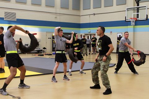 Sgt. Ali Asgary, the wrestling assistant coach with the U.S. Army World Class Athlete Program, shows Soldiers of 101st Airborne Division (Air Assault) Sustainment Brigade, 101st Abn. Div., the proper stance when training with a Bulgarian training bag, Nov. 15, 2016, at Shaw Physical Fitness Center on Fort Campbell, Ky. (Sgt. Neysa Canfield/101st Airborne Division Sustainment Brigade Public Affairs)