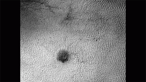 This sequence of three HiRISE images from NASA's Mars Reconnaissance Orbiter shows the growth of a branching network of troughs carved by thawing carbon dioxide over the span of three Martian years. This process may also form larger radially patterned channel features known as Martian "spiders." (NASA/JPL-Caltech/Univ. of Arizona)