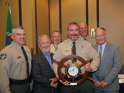 Melvin McLerran holds his award for being selected as the Tennessee Wildlife Resources Agency’s part-time Boating Office of the Year. Pictured (from left) are Boating and Law Enforcement Cpt. Dale Grandstaff, Tennessee Fish and Wildlife Commission chairman Harold Cannon, Col Glenn Moates, Officer McLerran, Boating and Law Enforcement chief, Lt. Col. Darren Rider, and TWRA Executive Director Ed Carter. 