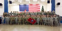 Guardsmen from Nashville’s 230th Signal Company pose for company photograph prior to boarding a bus to begin their journey to Fort Hood, Texas, for roughly one month of pre-deployment training. Following their training, the Soldiers will deploy to Kuwait for one year in support of Operation Spartan Shield. (Sgt. 1st Class Edgar Castro)