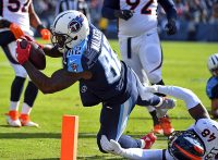 Tennessee Titans tight end Delanie Walker (82) dives after being hit out of bounds during the first half against the Denver Broncos at Nissan Stadium. (Christopher Hanewinckel-USA TODAY Sports)