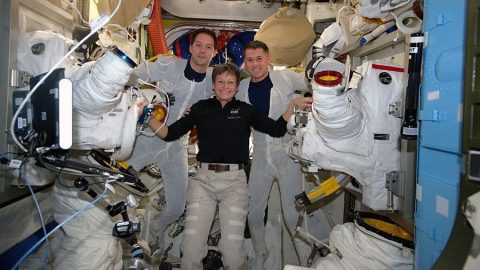 Astronaut Peggy Whitson (center) helps spacewalkers Thomas Pesquet (left) and Shane Kimbrough suit up before beginning their spacewalk Jan. 13, 2017. (NASA)