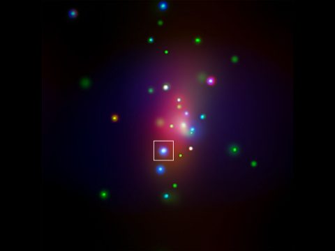 This image from NASA's Chandra X-ray Observatory shows spiral galaxy NGC 7331, center, in a three-color X-ray image. Red, green and blue colors are used for low, medium and high-energy X-rays, respectively. An unusual supernova called SN 2014C has been spotted in this galaxy, indicated by the box. (NASA/CXC/CIERA/R.Margutti et al)