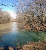 The mouth of Passenger Creek emptying into Red River