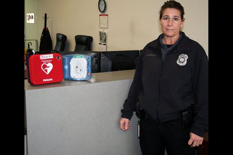 Lori McNulty, security officer at Clarksville City Hall, displays one of the automated external defibrillators, or AEDs, available at the City’s downtown facilities to help counter the risks associated with sudden cardiac emergencies. 