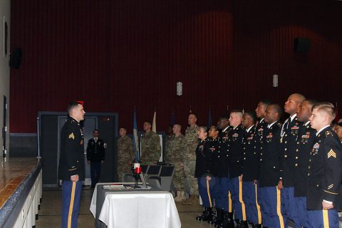 Sgt. Travis Bertovich, left, an intelligence analyst with 2nd Battalion, 44th Air Defense Artillery Regiment, 101st Airborne Division (Air Assault) Sustainment Brigade, 101st Abn. Div., stands in front of his newly-inducted peers to initiate the Creed of the Noncommissioned Officer, Feb. 2, 2017, during the brigade’s NCO induction ceremony at Wilson Theater, Fort Campbell, Kentucky. Although Bertovich started the creed, all NCOs in attendance recited it with him as part of an NCO tradition. (U.S. Army photo by Sgt. Neysa Canfield/101st Airborne Division Sustainment Brigade Public Affairs)