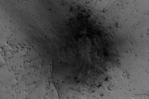 NASA's Mars Reconnaissance Orbiter has been observing Mars since 2006, enabling it to document many types of changes, such as the way winds alter the appearance of this recent impact site. (NASA/JPL-Caltech/Univ. of Arizona)