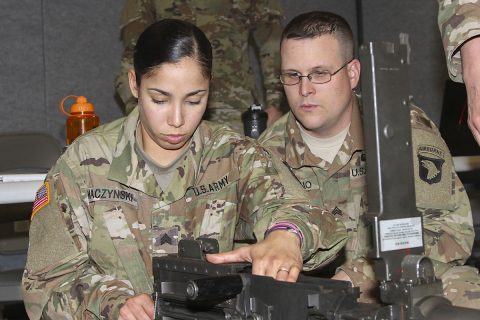 Sgt. Benjamin Rubino, right, motor transport operator, 129th Combat Sustainment Support Battalion, 101st Airborne Division Sustainment Brigade, 101st Abn. Div., watches Sgt. Beatriz Maczynski, left, motor transport operator, 129th CSSB, assemble a .50-caliber machine gun during a battalion-level master gunner course Feb. 8, 2017, at the Kinnard Mission Training Complex, Fort Campbell, Kentucky. (Sgt. Neysa Canfield/101st Airborne Division Sustainment Brigade Public Affairs) 