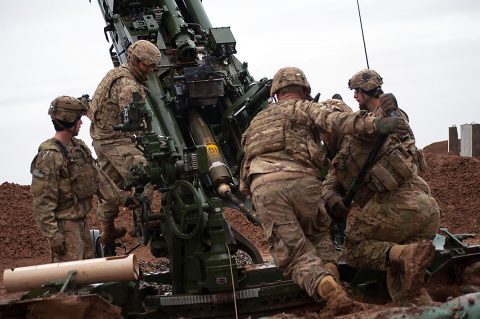 U.S Army Soldiers with Battery C, 1st Battalion, 320th Field Artillery Regiment, Task Force Strike, load a round into M777 artillery piece to support the Iraqi security forces during the Mosul counter offensive, Dec. 24, 2016, in northern Iraq. Battery C is supporting the ISF with indirect fires in their fight against ISIL. (1st Lt. Daniel Johnson) 