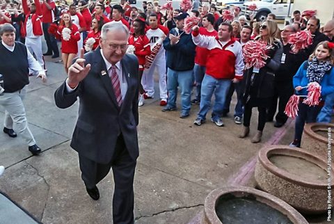 Austin Peay Basketball Coach Dave Loos waves to students as he enters the Dunn Center. (APSU Sports Information)