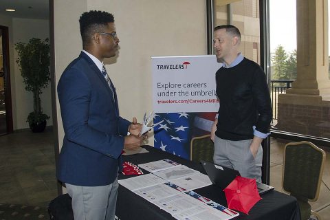 Specialist Avery Harbin, a Soldier assigned to the Warrior Transition Battalion, speaks to Tim Borowski, operations unit manager for Travelers, at the Soldier for Life - Transition Assistance Program and Army Community Service’s Employment Readiness Program International and National job fair March 22, 2017, at Cole Park Commons. Harbin will transition from the military to civilian life at the end of August. (Leejay Lockhart, Fort Campbell Public Affairs Office)