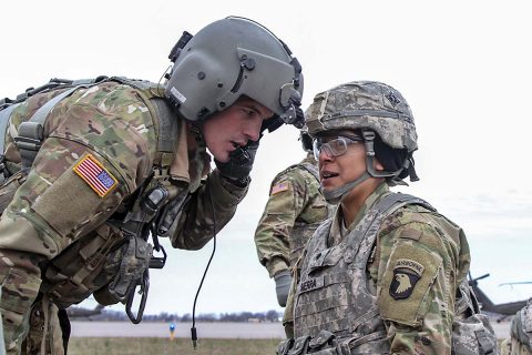 Spc. Janet Sierra (right), a cable systems installer-maintainer with 101st Special Troops Battalion, 101st Airborne Division (Air Assault) Sustainment Brigade, 101st Abn. Div., relays a simulated patient’s medical information to Staff Sgt. Andrew J. Six (left), a flight paramedic noncommissioned officer with Company C, 6th Bn., 101st Aviation Regiment, 101st Combat Avn. Bde., 101st Abn. Div., March 16, 2017, during medical evacuation training at Hanger 5, Fort Campbell, Kentucky. (Sgt. Neysa Canfield/101st Airborne Division Sustainment Brigade Public Affairs) 