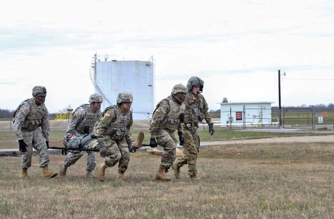 A four-man litter team from the 101st Special Troops Battalion, 101st Airborne Division (Air Assault) Sustainment Brigade, 101st Abn. Div., unloads a simulated patient from an aircraft, March 16, 2017, during medical evacuation training at Hanger 5, Fort Campbell, Kentucky. (Sgt. Neysa Canfield/101st Airborne Division Sustainment Brigade Public Affairs) 