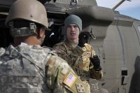 Staff Sgt. Andrew J. Six (right), a flight paramedic noncommissioned officer with Charlie Company, 6th Battalion, 101st Aviation Regiment, 101st Combat Aviation Brigade, 101st Airborne Division (Air Assault), explains aircraft safety, March 16, 2017, during load training with Soldiers from the 101st Special Troops Battalion, 101st Airborne Division Sustainment Brigade on Fort Campbell, Kentucky. (Sgt. Neysa Canfield/101st Airborne Division Sustainment Brigade Public Affairs)