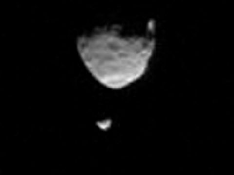 This sequence of images from NASA's Curiosity Mars rover shows one of Mars' two moons, Phobos, passing directly in front of the other, Deimos, in 2013. (NASA/JPL-Caltech/Malin Space Science Systems/Texas A&M Univ.)