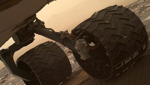 Two of the raised treads, called grousers, on the left middle wheel of NASA's Curiosity Mars rover broke during the first quarter of 2017, including the one seen partially detached at the top of the wheel in this image from the Mars Hand Lens Imager (MAHLI) camera on the rover's arm. (NASA/JPL-Caltech/MSSS)