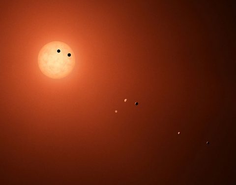 This illustration shows the seven TRAPPIST-1 planets as they might look as viewed from Earth using a fictional, incredibly powerful telescope. (NASA/JPL-Caltech)