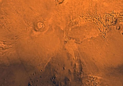 New research using observations from NASA's Mars Reconnaissance Orbiter indicates that Arsia Mons, one of the largest volcanos on Mars, actively produced lava flows until about 50 million years ago. This wide view of the volcano is from the Viking 1 Orbiter. (NASA/JPL/USGS) New research using observations from NASA's Mars Reconnaissance Orbiter indicates that Arsia Mons, one of the largest volcanos on Mars, actively produced lava flows until about 50 million years ago. This wide view of the volcano is from the Viking 1 Orbiter. (NASA/JPL/USGS)