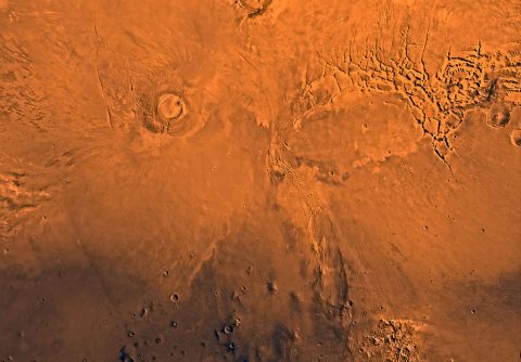 New research using observations from NASA's Mars Reconnaissance Orbiter indicates that Arsia Mons, one of the largest volcanos on Mars, actively produced lava flows until about 50 million years ago. This wide view of the volcano is from the Viking 1 Orbiter. (NASA/JPL/USGS)