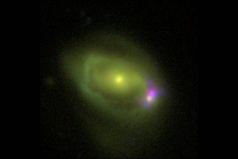 This optical image shows the Was 49 system, which consists of a large disk galaxy, Was 49a, merging with a much smaller "dwarf" galaxy Was 49b. (DCT/NRL) This optical image shows the Was 49 system, which consists of a large disk galaxy, Was 49a, merging with a much smaller "dwarf" galaxy Was 49b. (DCT/NRL)