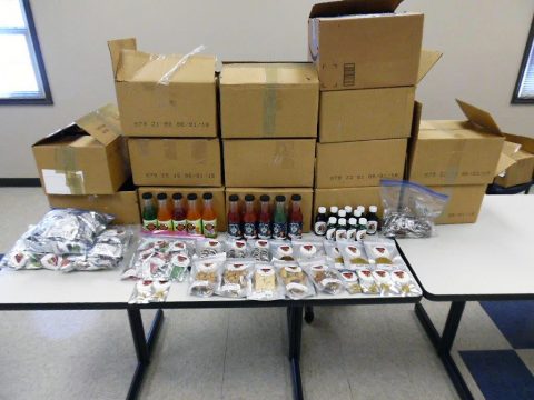 Tennessee Highway Patrol officers make traffic stop and discover boxes in bed of truck filled with marijuana, 64 pounds of THC edibles and 263 bottles (3,156 fluid ounces) of THC infused drinks and syrup.