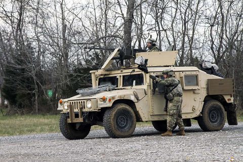 A squad leader with 1st Platoon, 194th Military Police Company, 716th MP Battalion, 101st Airborne Division (Air Assault) Sustainment Brigade, 101st Abn. Div., directs a Soldier, March 14, 2017, as the platoon establishes a traffic control point during a platoon external evaluation on Fort Campbell, Kentucky. (Sgt. Neysa Canfield/101st Airborne Division Sustainment Brigade Public Affairs) 