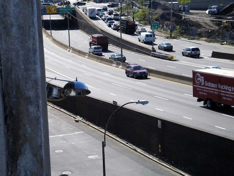 (At left), Air quality equipment monitors traffic-related air pollution on a New York City highway. (The MESA Air Study)