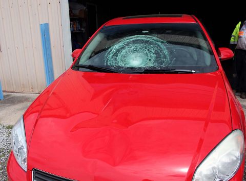 Chevy Impala strikes a pedestrian crossing Madison Street, Wednesday. 