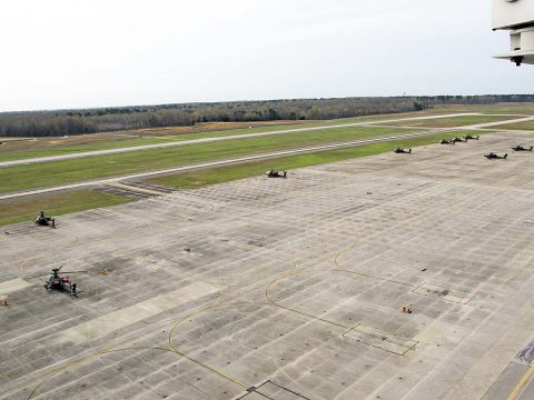 Sabre Army Airfield normally serves rotor wing aircraft such as these AH-64 Apache attack helicopters parked on a ramp across from the runway March 30, 2017. However, in coming weeks fixed wing aircraft such as C-17s will make use of the runway while Campbell Army Airfield undergoes repairs. (Leejay Lockhart, Fort Campbell Public Affairs Office)