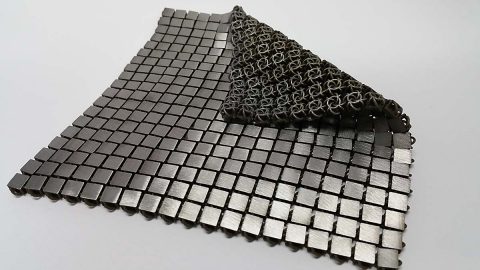 Another example of a 3-D-printed metallic "space fabric." The bottom and top sides of the fabric are designed to have different functionality. (NASA/JPL-Caltech)