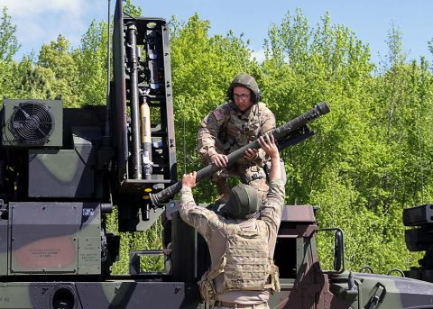 Staff Sgt. Josh Robinson (bottom), an air and missile defense crewmember assigned to Battery C, 2nd Battalion, 44th Air Defense Artillery Regiment, 101st Airborne Division (Air Assault) Sustainment Brigade, 101st Abn. Div., hands a training missile to Spc. Bradley Muszalski, an air and missile defense crewmember assigned to Btry. C, 2nd Bn., 44th ADA Regt., 101st Abn. Div. Sust. Bde., 101st Abn. Div., during missile upload and download crew drills, April 25, 2017, during their battery field training exercise on Fort Campbell, Kentucky.  (Sgt. Neysa Canfield/101st Airborne Division Sustainment Brigade Public Affairs) 