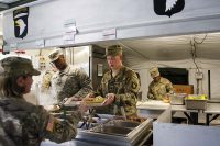 Sergeant Brandon Keller and Spc. Ontroy Canty, food service specialists assigned to E Company, 6th Battalion, 101st General Support Aviation Battalion, 101st Combat Aviation Brigade, 101st Airborne Division, serve breakfast during an aerial refueling exercise for the field feeding portion of the Philip A. Connelly Program May 11, 2017 at Fort Campbell, Kentucky.(Leejay Lockhart, Fort Campbell Public Affairs Office)