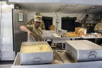Private 1st Class Desiree Slaton, a food service specialist assigned to E Company, 6th Battalion, 101st General Support Aviation Battalion, 101st Combat Aviation Brigade, 101st Airborne Division, prepares potatoes au gratin for the field feeding portion of the Philip A. Connelly Program May 11, 2017, at Fort Campbell, Kentucky.  (Leejay Lockhart, Fort Campbell Public Affairs Office)