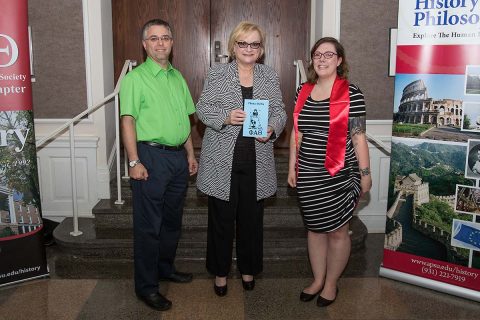 APSU's Phi Alpha Theta presents APSU President Alisa White with the first printing of its now-seventh volume of Theta-Delta. (Cassidy Graves, APSU)