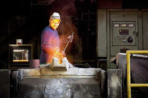 Clarksville Foundry employee Larry Hale stirs molten iron prior to the pouring of components for the replica Model 1841 6-Pounder Field Gun. Clarksville Foundry cast the entire Civil War-era replica cannon, including the barrel and carriage. Clarksville Rotary Club commissioned the cannon in honor of its 100th Anniversary this month. (Lisa Kemmer)