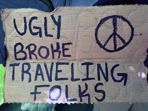 Sign the panhanders were seen carrying. Sign the panhanders were seen carrying.
