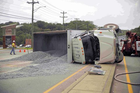 International dump truck rolls over on North Second Street. (Jim Knoll, CPD)