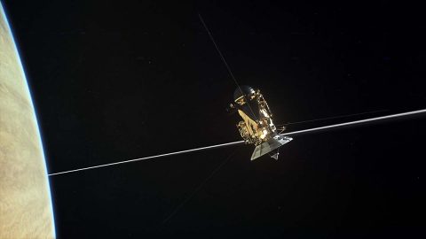 NASA's Cassini spacecraft is shown diving through the gap between Saturn and its rings in this artist's depiction. (NASA/JPL-Caltech)