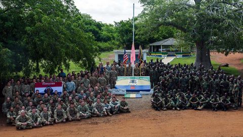 U.S. Army Soldiers assigned to the 1st Battalion, 506th Infantry Regiment, 1st Brigade Combat Team, 101st Airborne Division and Ghana Armed Forces soldiers from the 5th Infantry Battalion, Arakan Barracks, Burma Camp, pose for a group photo during United Accord 2017 at Bundase Training Camp, Bundase, Ghana, May 29, 2017. (U.S. Army photo by Spc. Victor Perez Vargas) 