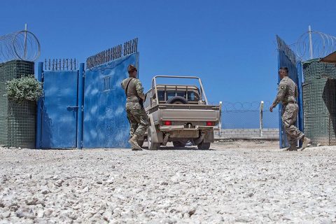 U.S. Army Spc. Tyler Curtis and Spc. Blaine Grubb allow a Somali National Army (SNA) vehicle through the gate at a training site in Mogadishu, Somalia, on May 23, 2017, during a logistics course with the 101st Airborne Division from Fort Campbell, KY. These U.S. Soldiers, who belong to the 101st AD’s 1st Brigade, 1st Battalion, Delta Company, 3rd Platoon, were tasked to secure the training site during a logistics training course for the SNA. (U.S. Air National Guard photo by Tech. Sgt. Joe Harwood) 