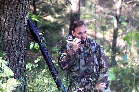 A Soldier with the 2nd Battalion, 502nd Infantry Regiment of Fort Campbell, Ky., calls over the radio for plans for a new training scenario during operations for the Exportable Combat Training Capability (XCTC) Exercise at a South Post training area on June 9, 2017, at Fort McCoy, WI. (Scott T. Sturkol, Public Affairs Office, Fort McCoy, WI) 