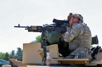 A Soldier with the 1st Battalion, 178th Infantry Regiment of the Illinois National Guard who is at Fort McCoy for training in the Exportable Combat Training Capability (XCTC) Exercise prepares a weapon for gunnery training at Range 26 on June 9, 2017, at Fort McCoy, WI. (Scott T. Sturkol, Public Affairs Office, Fort McCoy, WI)